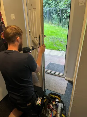 Three Sixty Joiner repairing a door handle